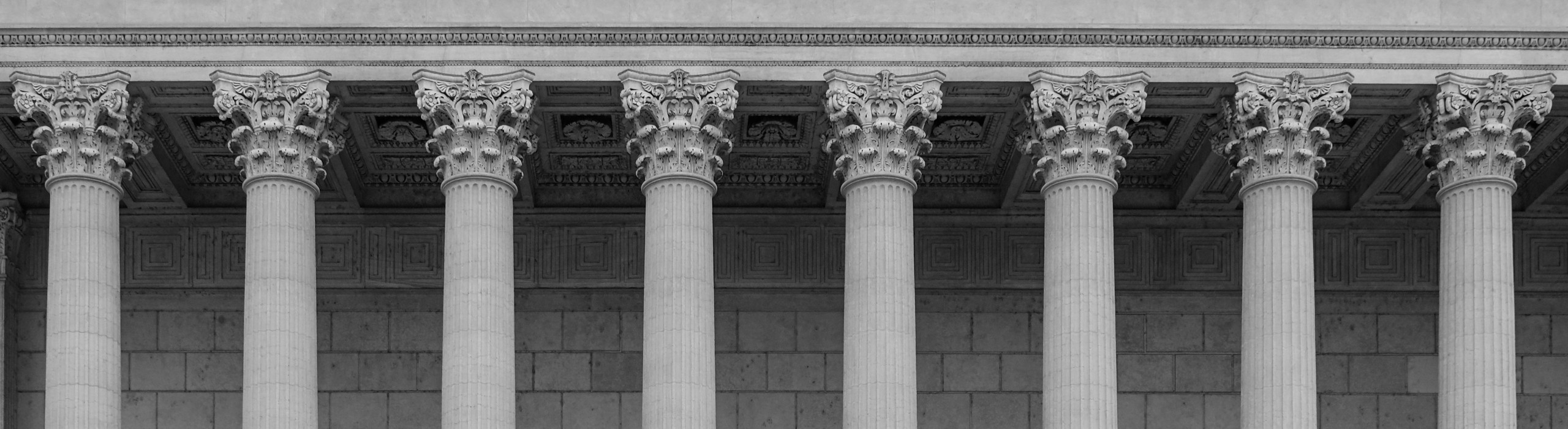 Farrell Thurman & Flammer, P.C. signature banner of courthouse pillars in black and white.